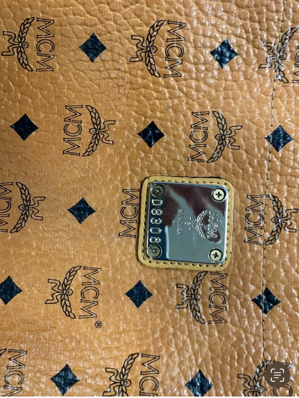 MCM Cognac and Black Visetos Monogram Pouch with Gold Plaque.